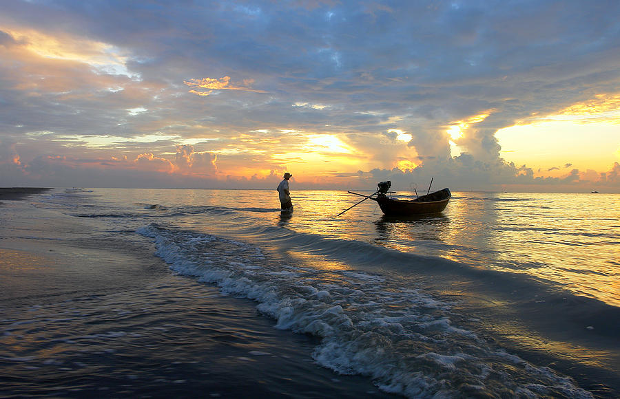 Fisherman And His Boat Photograph by ExploringMekong.com