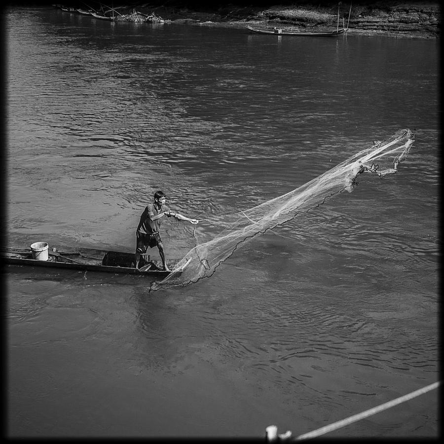 Sports Photograph - Fisherman in Luang Prabang by Luca Sartor