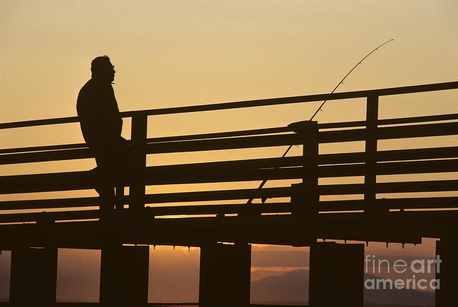 Fisherman on Pier at Sunset Photograph by Jim Corwin