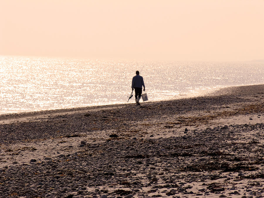 Fisherman Leaving Beach Photograph by Eunice Harris