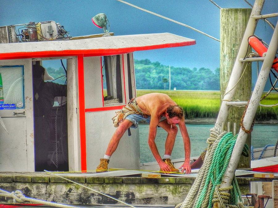 Fisherman Working on His Boat Photograph by Patricia Greer