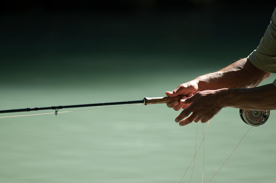 Fishermans Hands Holding A Fly Fishing Photograph by Alain Denis - Fine ...