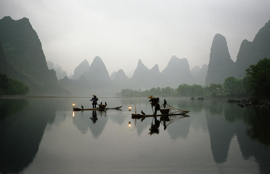 Bird Photograph - Fishermen in China with cormorant birds on Li River by King Wu