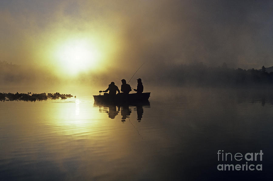 Fishermen in small boat Photograph by Jim Corwin