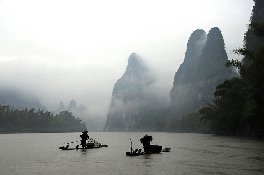 Fishermen With Bamboo Raft In Li River Photograph by Melindachan