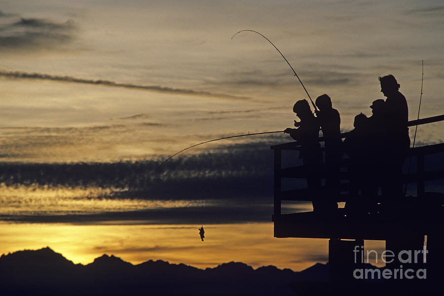Fishing At Sunset Photograph by Jim Corwin