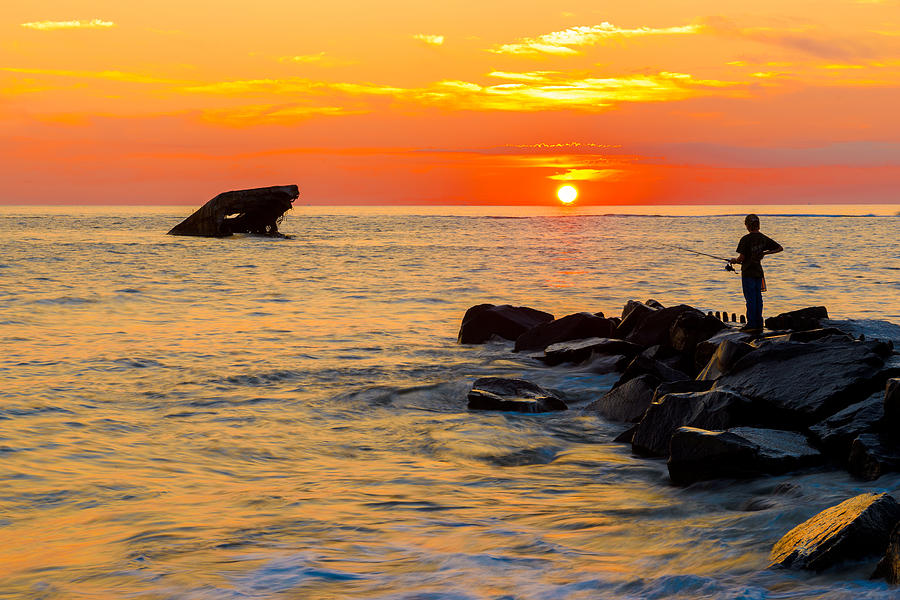 Fishing at Sunset Photograph by Mark Rogers