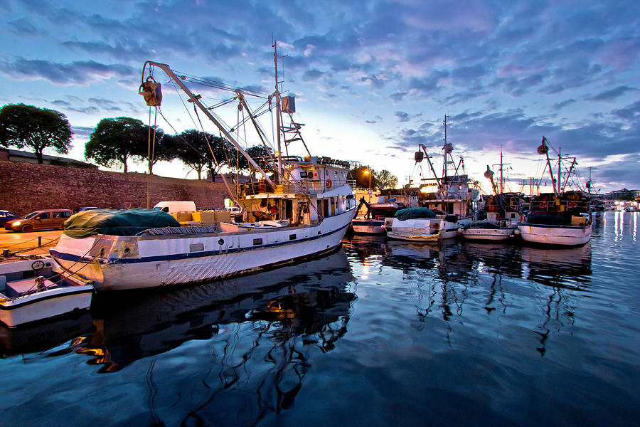 Fishing boats on colorful sunset Photograph by Brch Photography