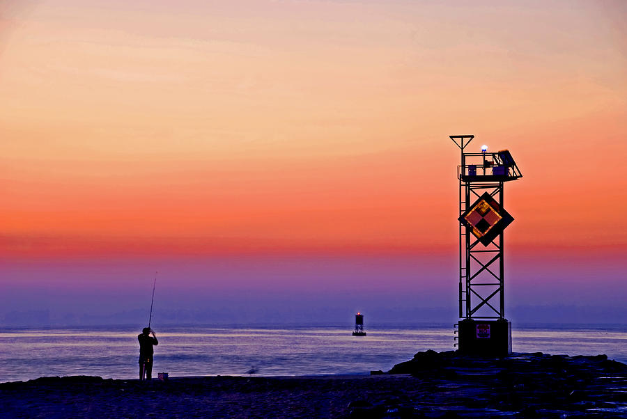 Fishing near the Ocean City jetty Photograph by Bill Jonscher