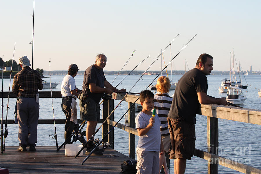 Fishing Off The Bayside Pier Photograph by John Telfer
