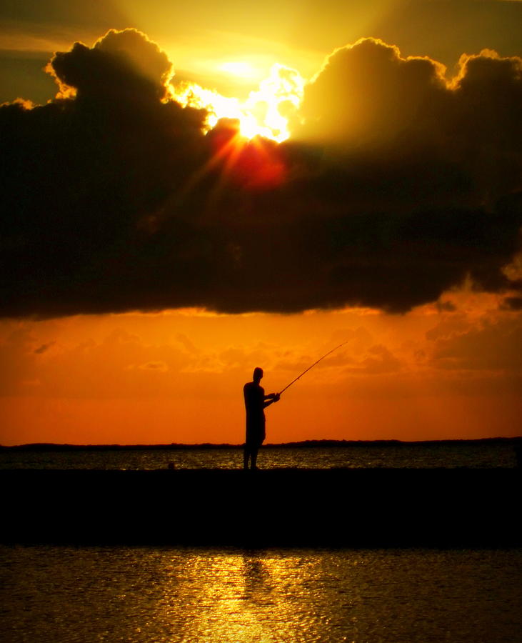 Sunset Photograph - FISHING the SUN by Karen Wiles