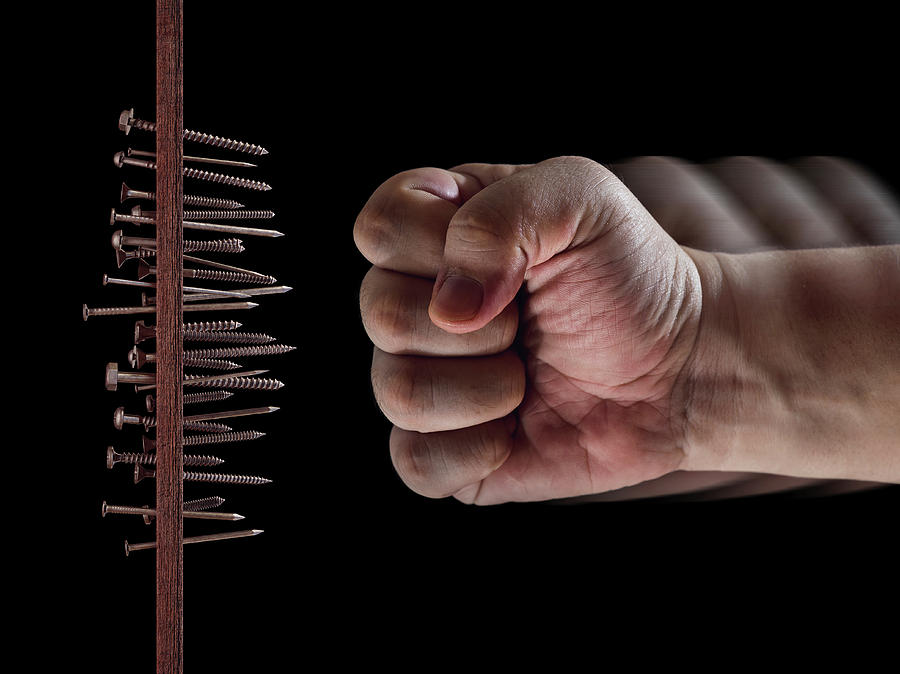 Nail Photograph - Fist Hitting Nails And Screws by Ktsdesign
