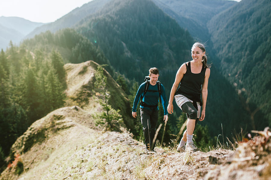 Fit Mature Couple on Mountain Hike Photograph by RyanJLane