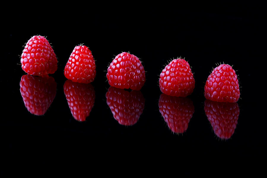 Summer Photograph - Five red raspberries by Ness Welham