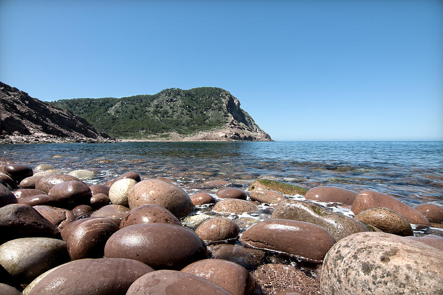 five steps to paradise - Giant pebbles is Menorca north shore close to Cala Pilar beach Photograph by Pedro Cardona Llambias