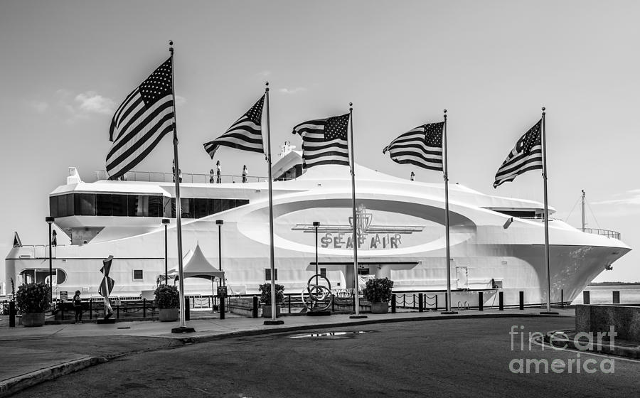Black And White Photograph - Five US Flags flying proudly in front of the megayacht Seafair - Miami - Florida - Black and White by Ian Monk