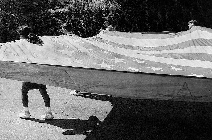 Flag bearing marchers inflated flag patriotic parade Tucson Arizona black and white  Photograph by David Lee Guss