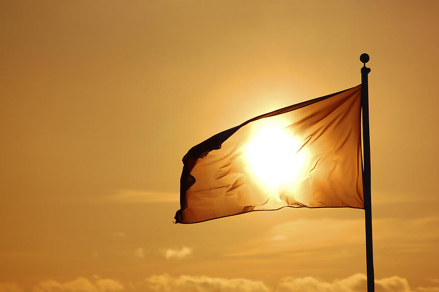 Flag in the Sun Photograph by Eric Chamberland - Fine Art America