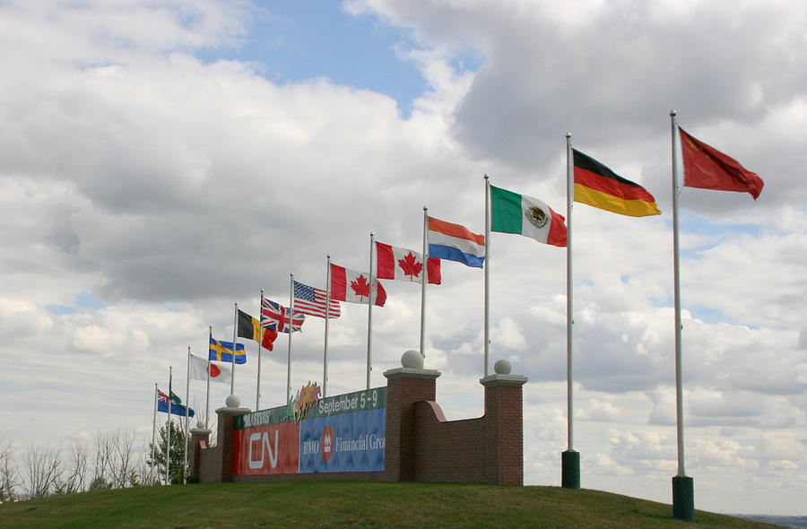 Flags at Spruce Meadows Photograph by Betty-Anne McDonald