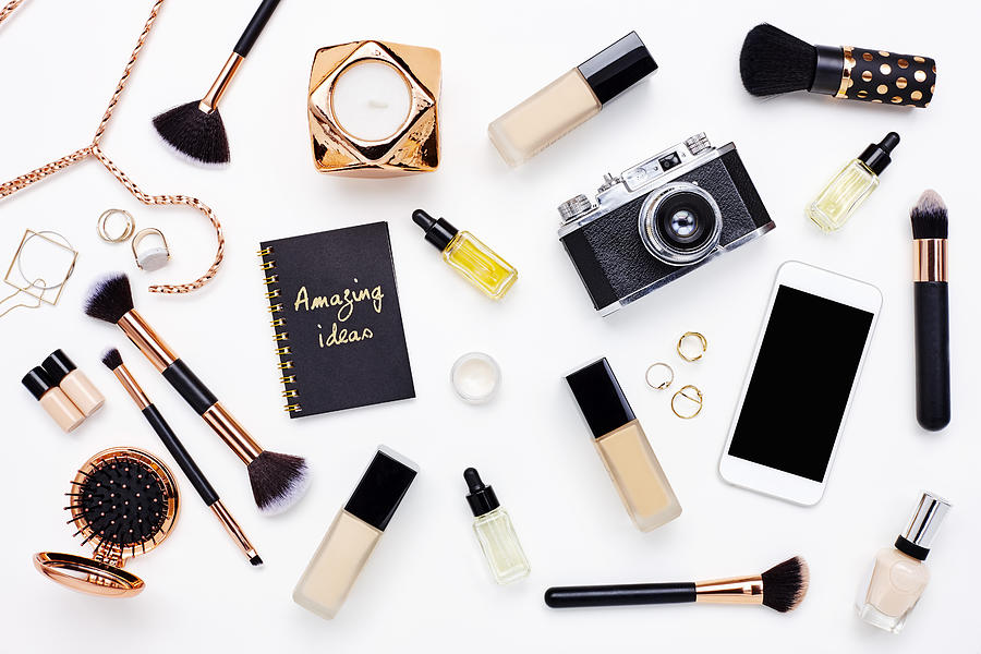 Flat lay of beauty products on bloggers desk Photograph by Neustockimages