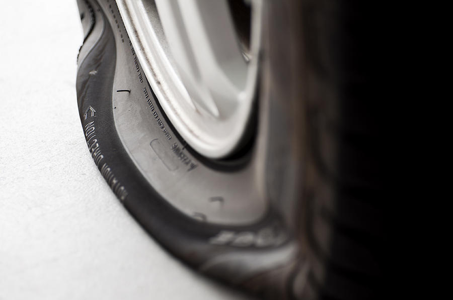 Flat Tire Close-up Photograph by 1MoreCreative