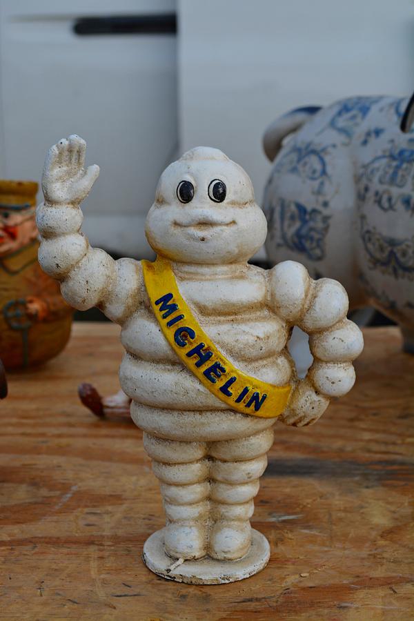 Flea market Michelin Man Photograph by Helene Dignard