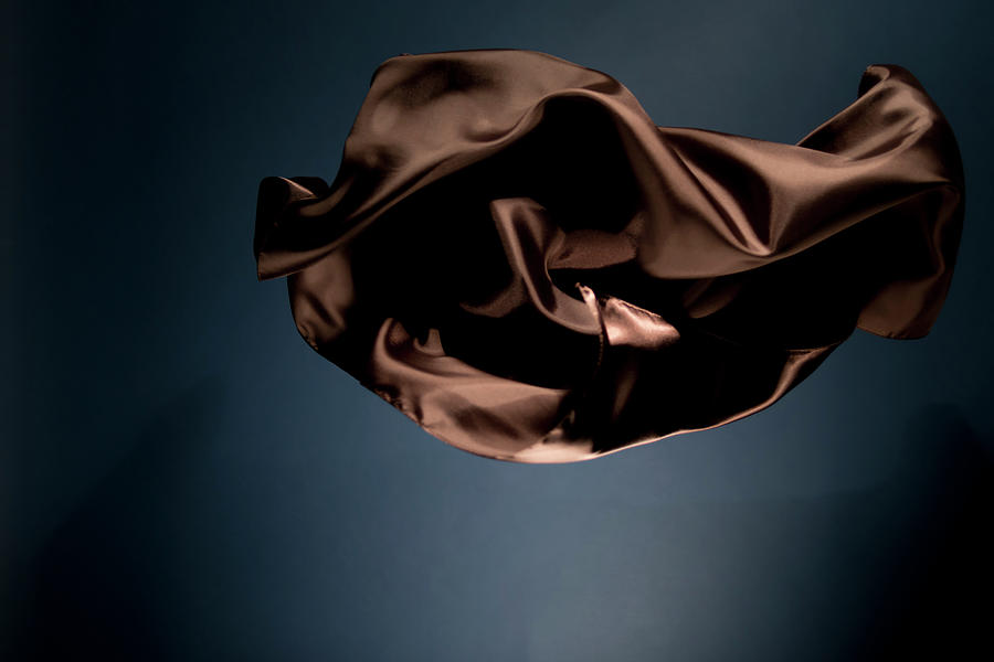 Floating Brown Satin On A Dark Blue Photograph by Gm Stock Films