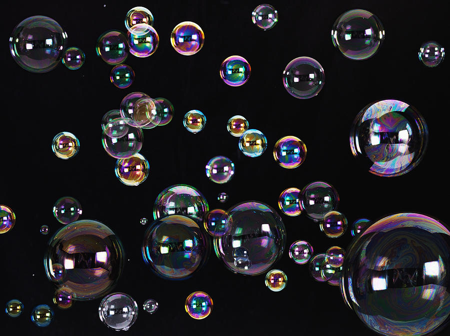 Floating bubbles Photograph by Robert Daly
