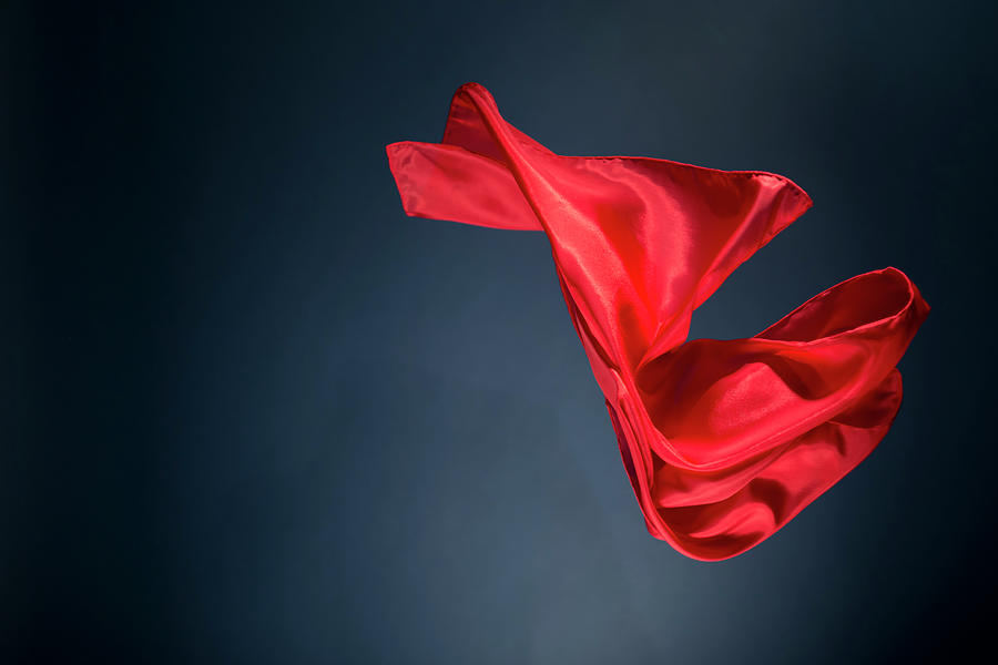 Floating Red Satin On A Dark Blue Photograph by Gm Stock Films