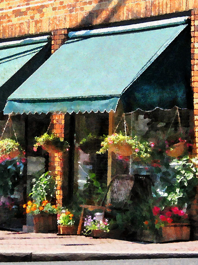 Flower Shop With Green Awnings Photograph by Susan Savad
