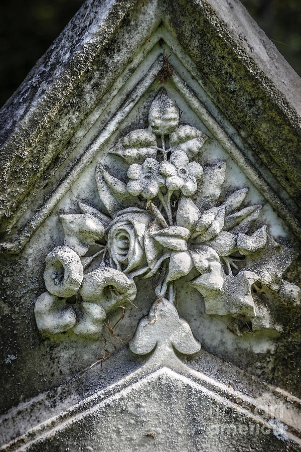 Flowers on a grave stone Photograph by Edward Fielding