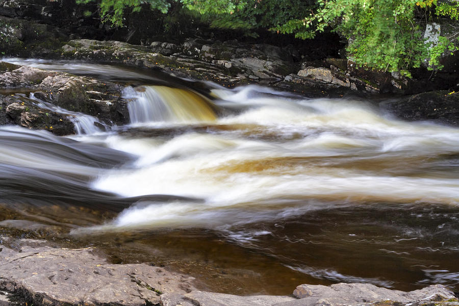 Flowing and Cascading at the Falls of Dochart - Killin Scotland Photograph by Jason Politte
