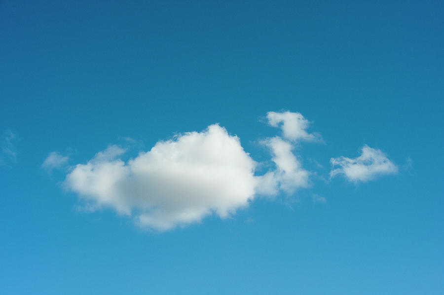 Fluffy Clouds In A Blue Sky Photograph by Brian Stablyk