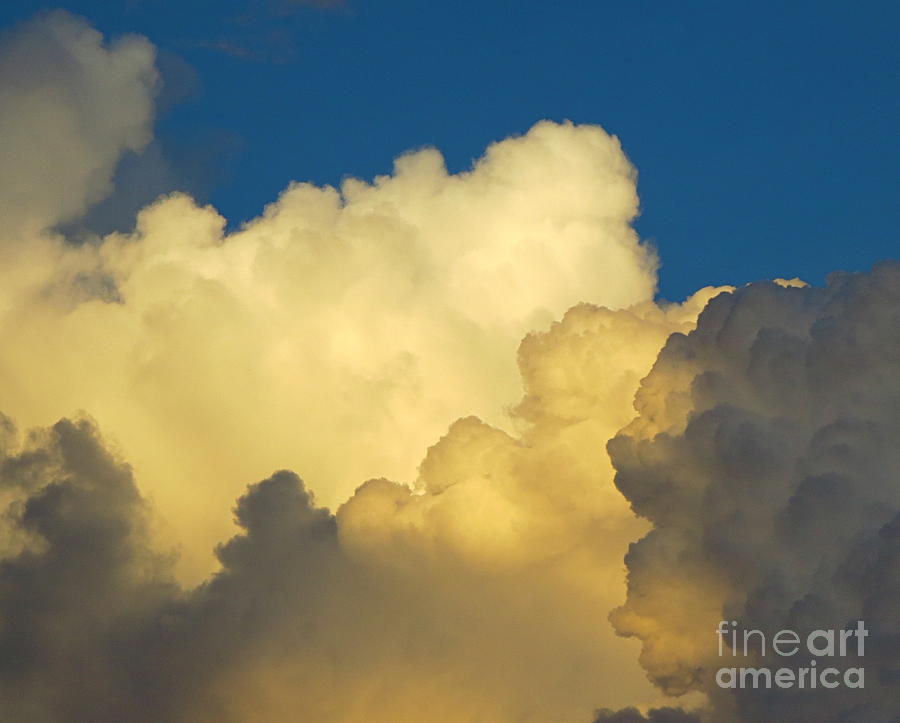 Fluffy Clouds. White. Yellow. Grey. Photograph by Robert Birkenes