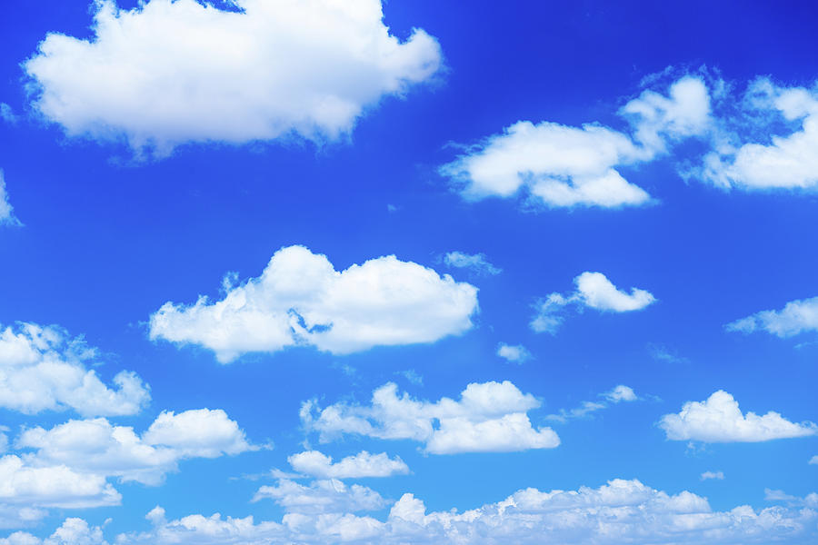 Fluffy White Clouds In A Blue Sky Photograph by Emrah Turudu