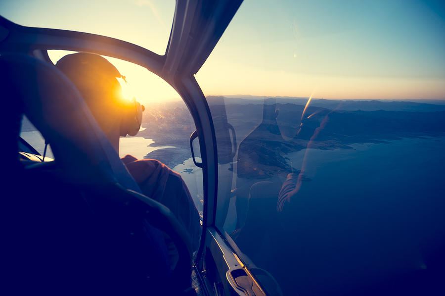 Flying in a helicopter over lake mead in Arizona. Photograph by Courtneyk