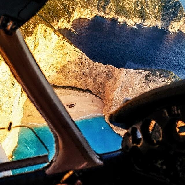 Beach Photograph - Flying Low Over Navagio Beach Shipwreck by Alistair Ford