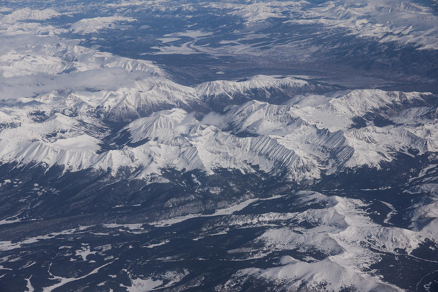 Flying Over the Snow Covered Rocky Mountains Photograph by Georgia Mizuleva