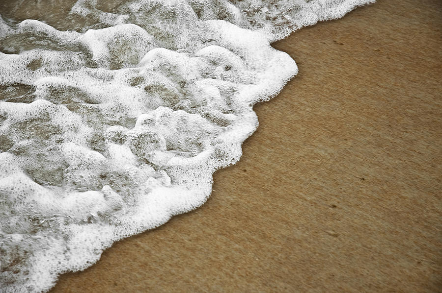 Foamy Beach Tide Photograph by Carolyn Marshall