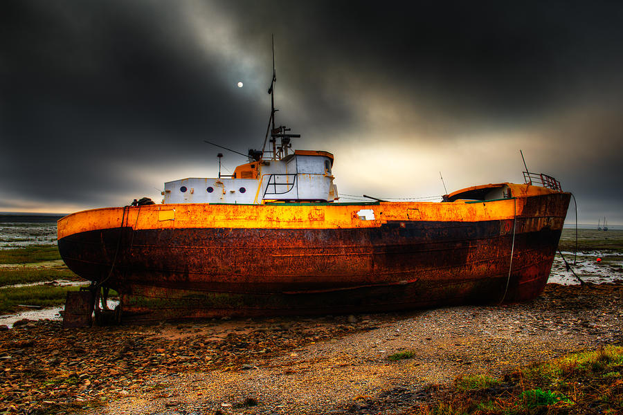 Foggy Sun over Beached Fishing Boat in Rampside UK Photograph by Dennis Dame