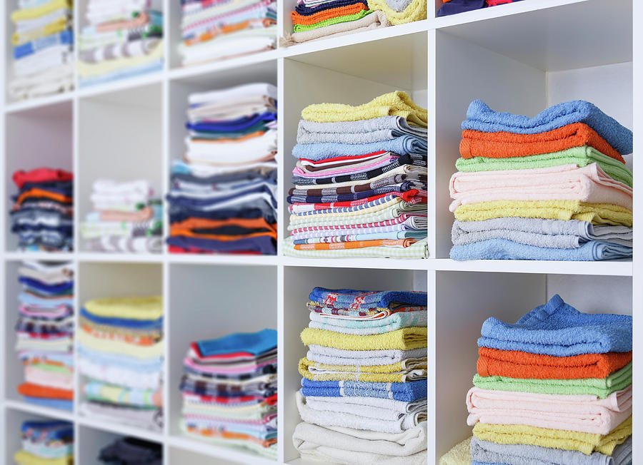 Clothing Photograph - Folded Towels On Shelves by Wladimir Bulgar