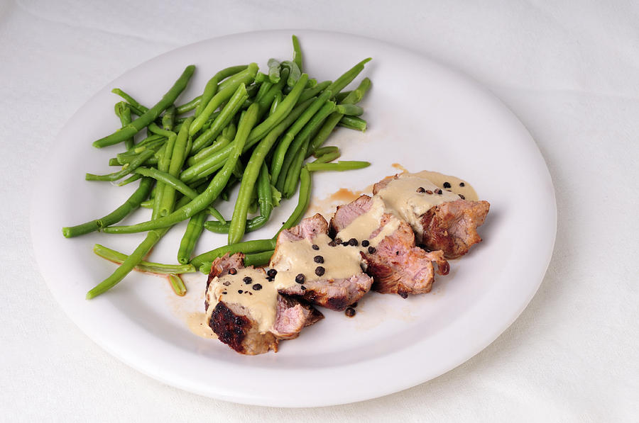 Food - Pork filet with green beans Photograph by Matthias Hauser
