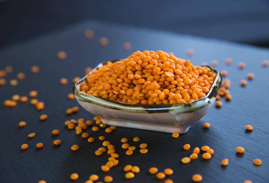 Food - small bowl with red lentils dark blue background Photograph by Matthias Hauser