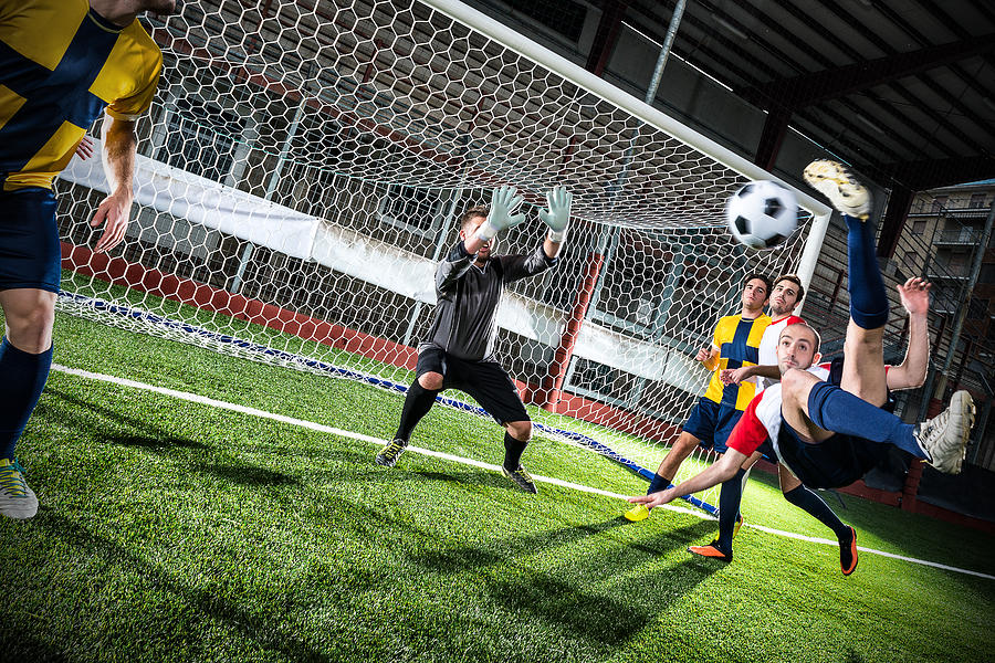 Football match in stadium: Bicycle kick Photograph by Ilbusca