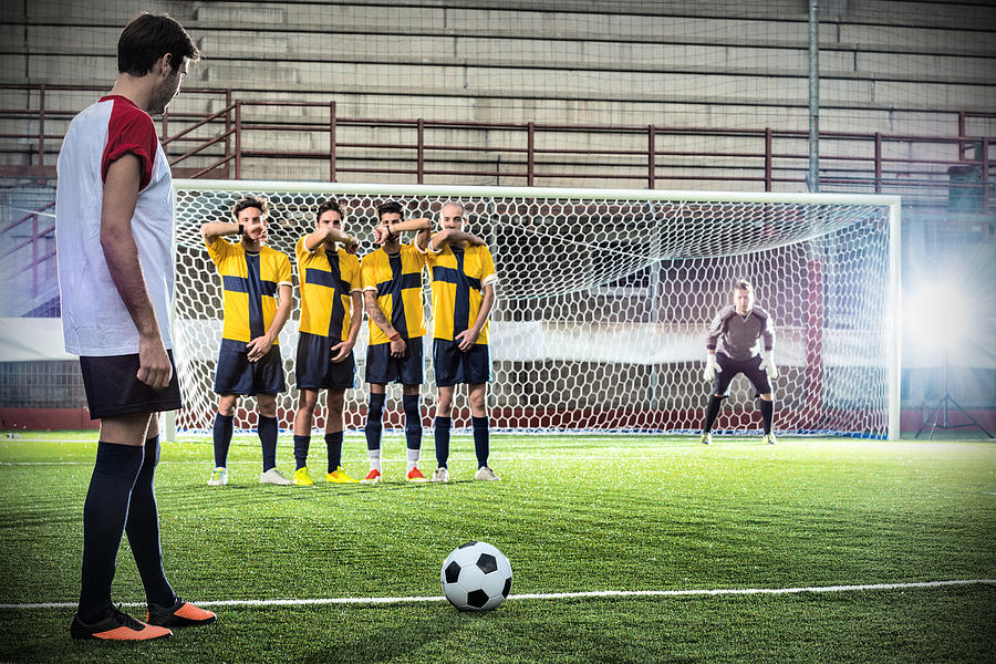 Football match in stadium: Free kick Photograph by Ilbusca