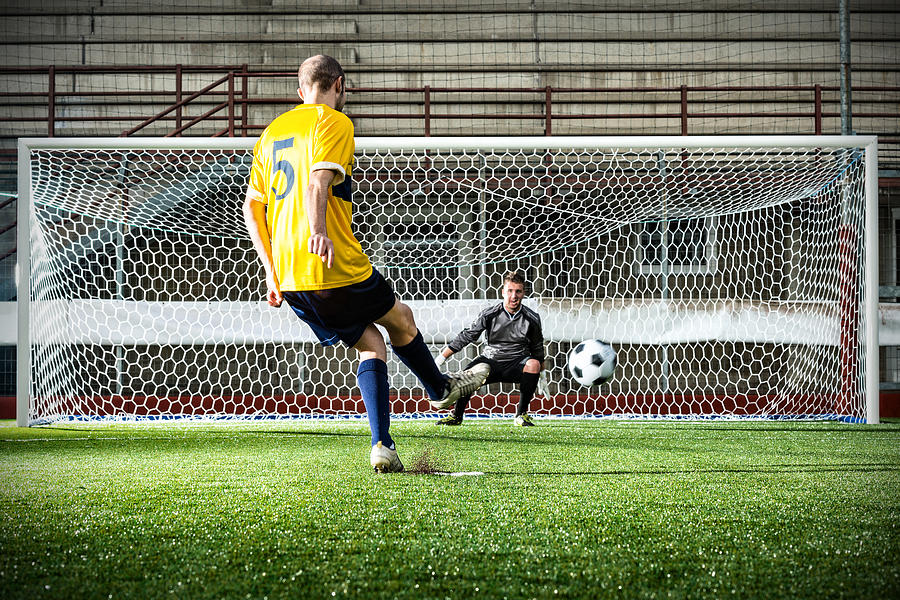 Football match in stadium: Penalty kick Photograph by Ilbusca