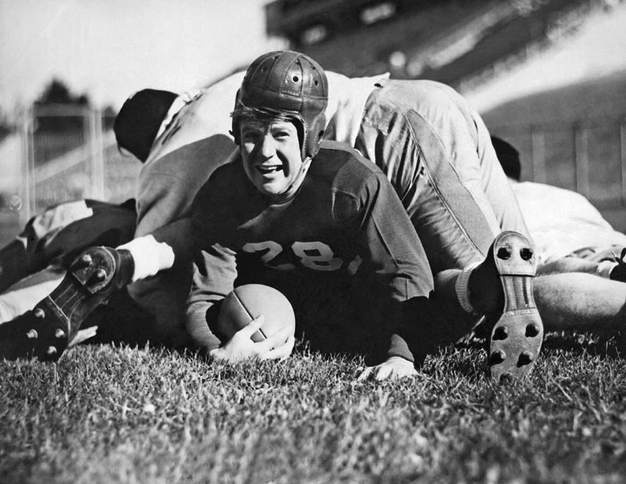 Athlete Photograph - Football Player Gets Tackled by Underwood Archives