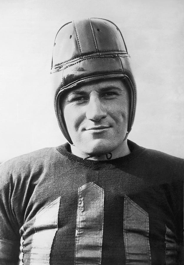 Black And White Photograph - Football Player Portrait by Underwood Archives