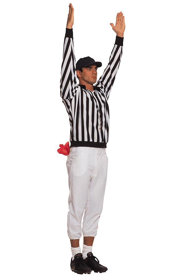 Football referee signaling touchdown Photograph by Comstock