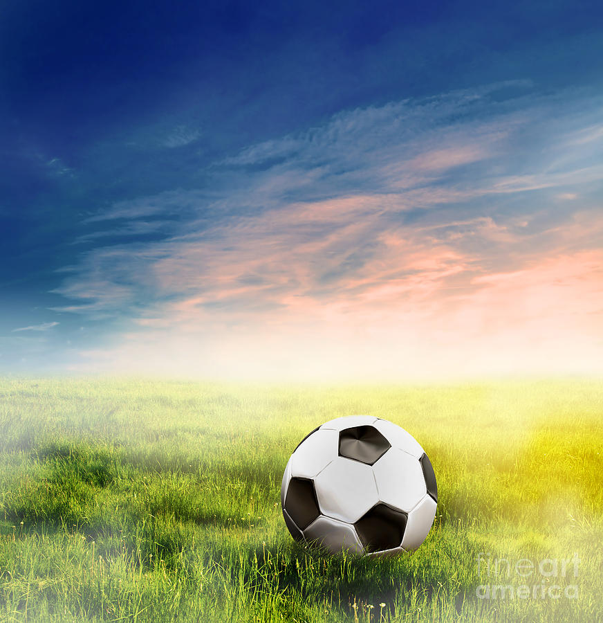 Football soccer ball on green grass #2 Photograph by Michal Bednarek